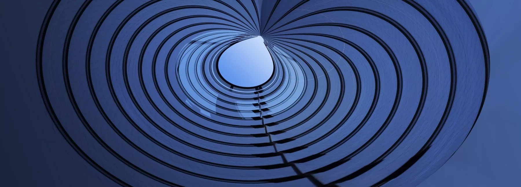 A decorative image of an abstract office interior for Marksman Wealth Advisors' about page, again depicting concentric lines and recalling the focus that Markman has on its clients' wishes and goals