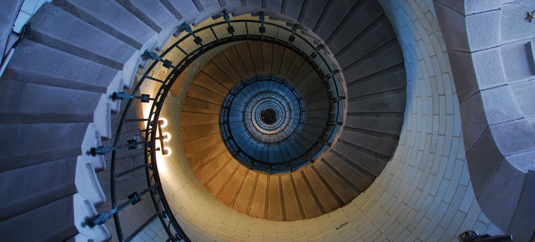 Winding Stairs in a tower, illustrating the idea of focus for Marksman Wealth Management's aim of client-focused financial planning in New Braunfels, Texas.